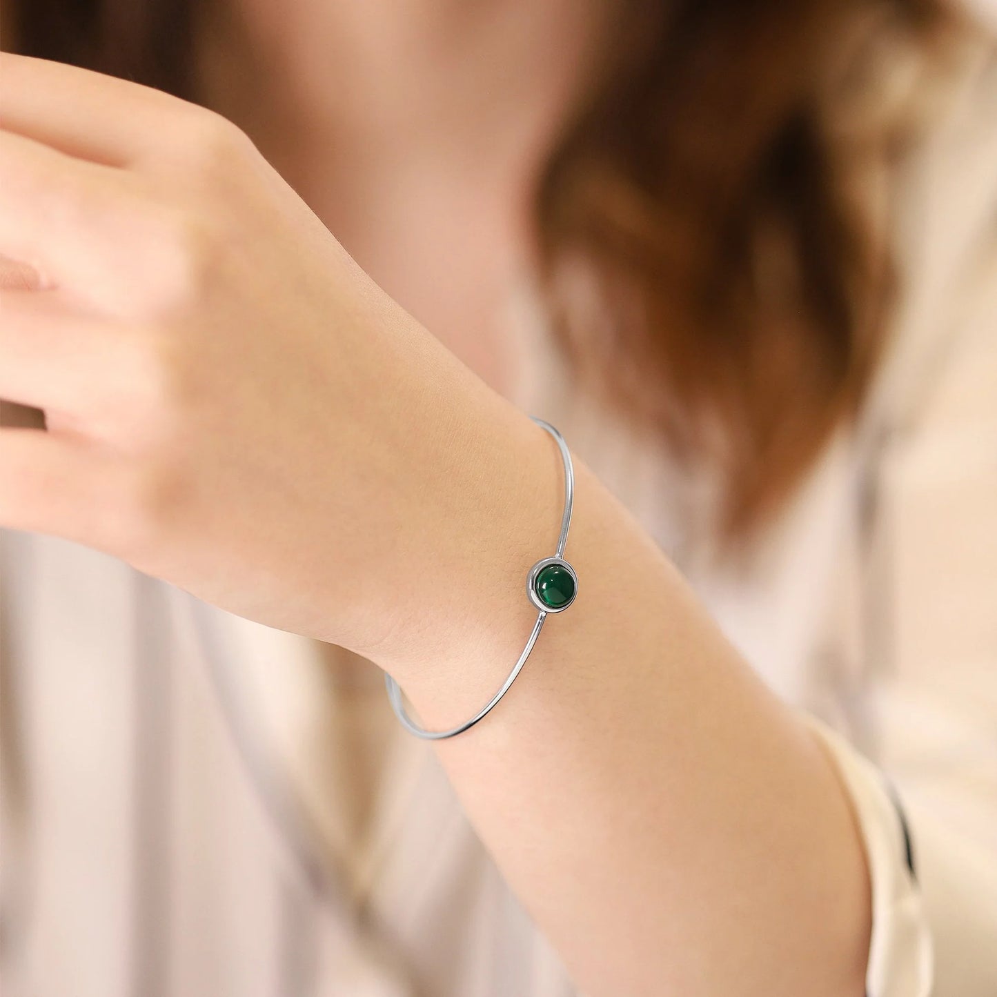 Silver rhodium plated bangle with Green quartz