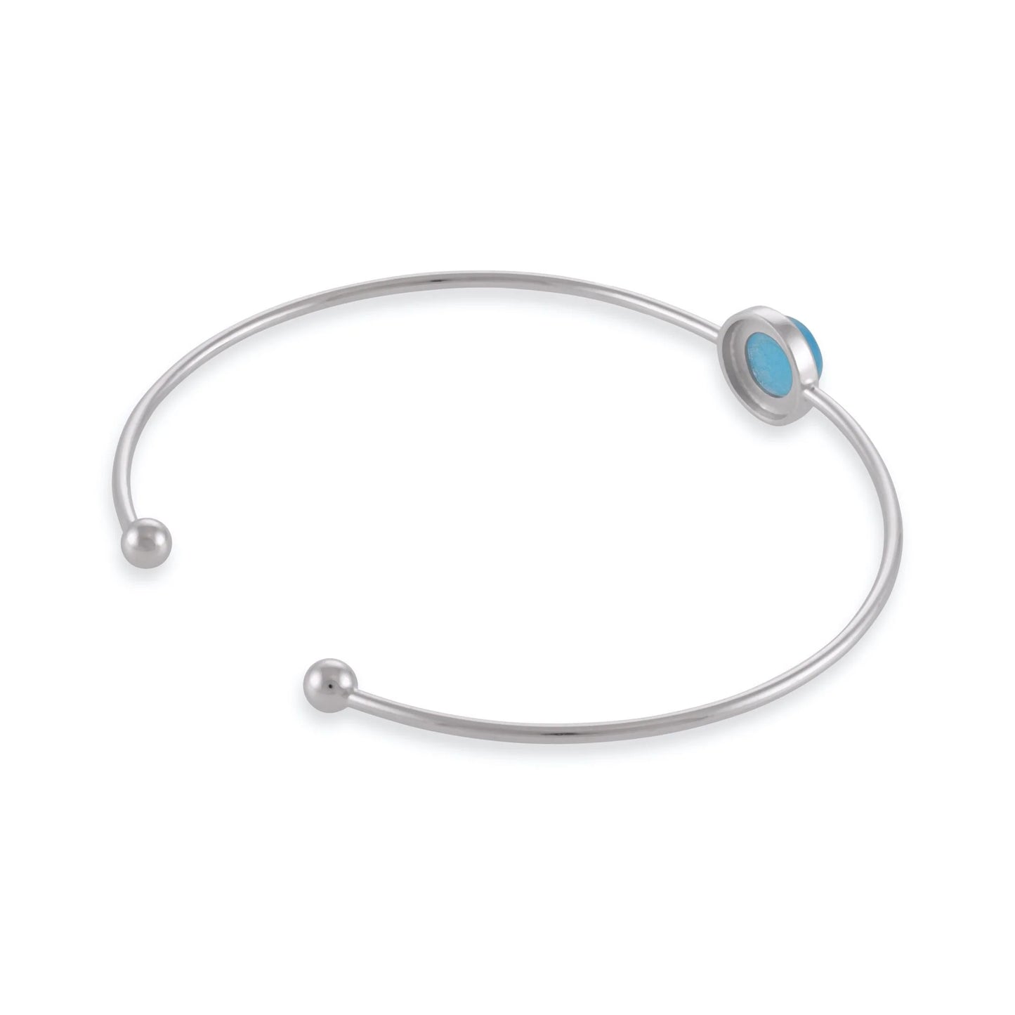 Silver rhodium plated bangle with blue quartz