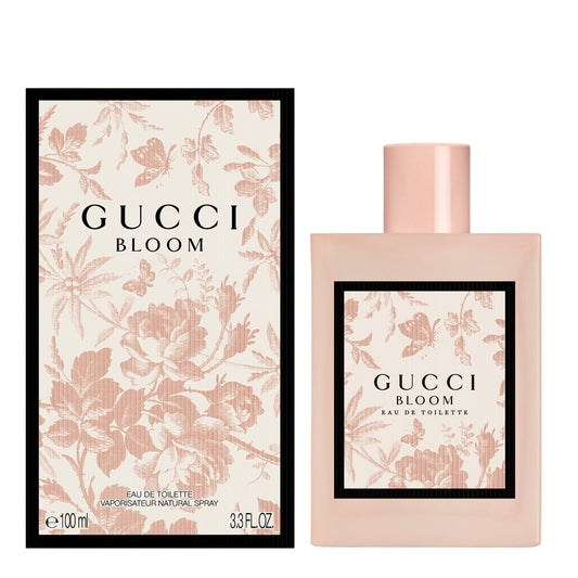 Gucci Bloom perfume bottle and packaging with floral design on a white background