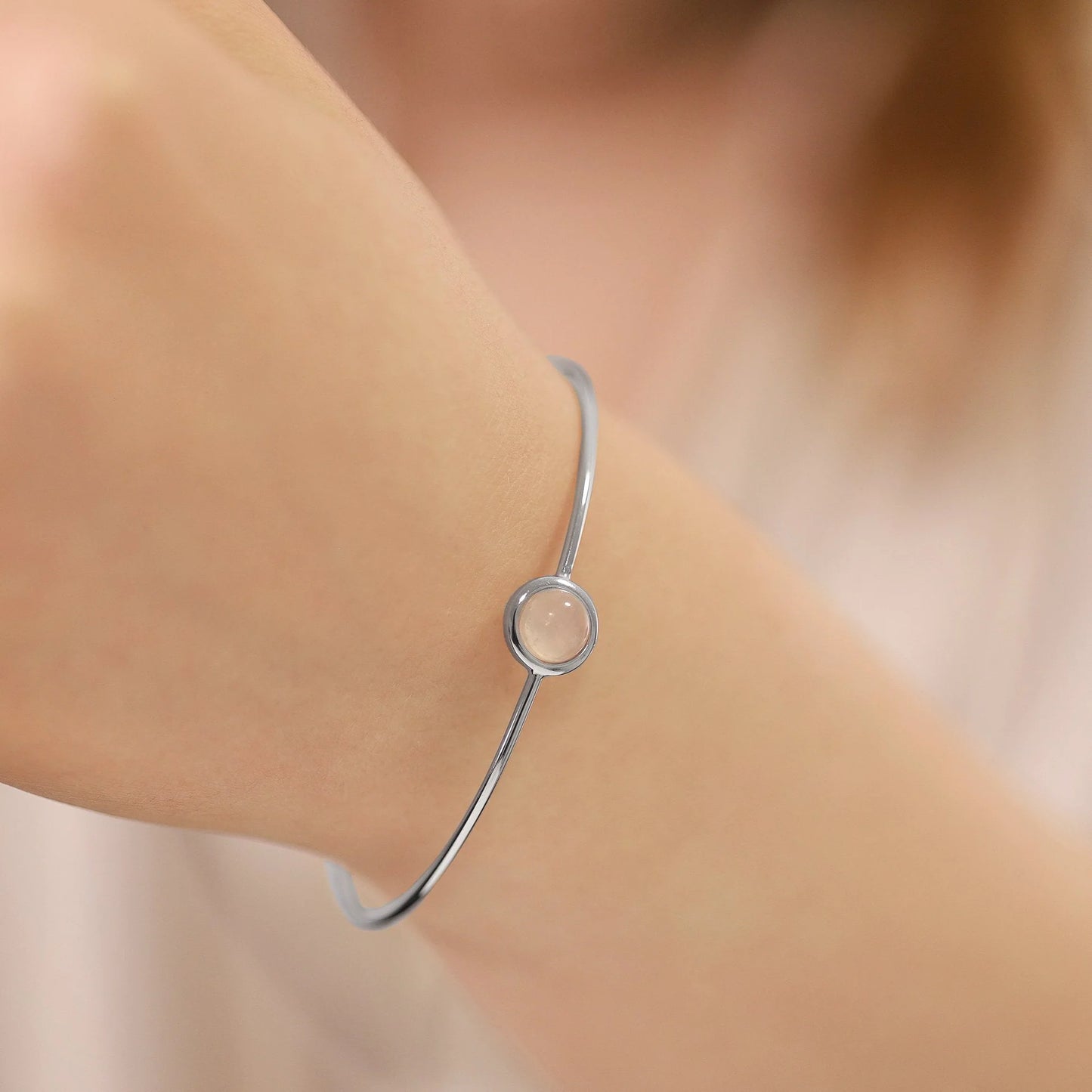 Silver rhodium plated bangle with Pink quartz